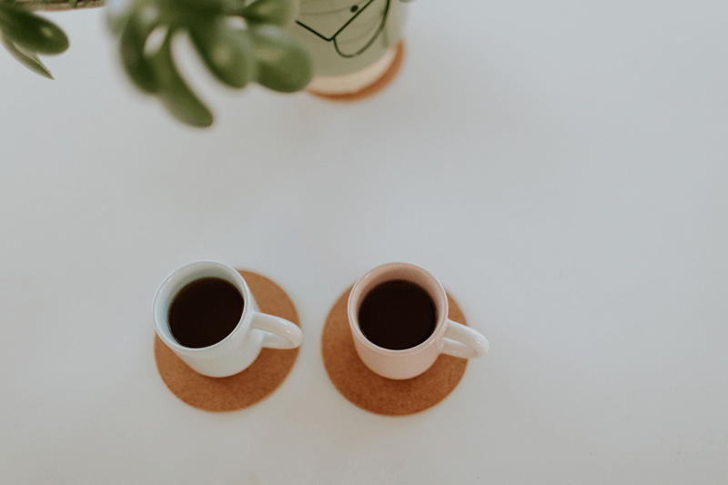 Two cups of herbal tea on a table inside a Chinese herbal medicine shop in Brisbane
