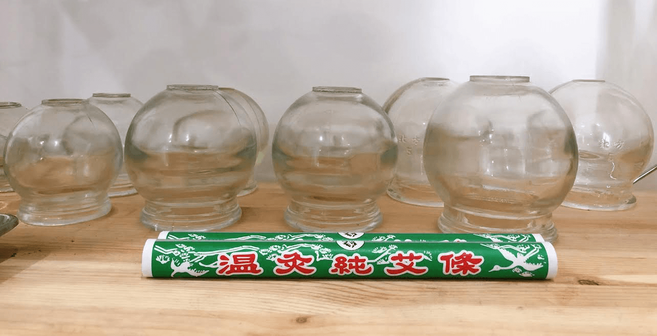 Row of cups used during cupping massage therapy in Brisbane